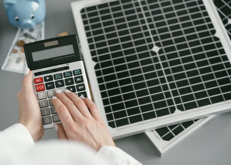 Calculator and documents estimating solar panel cost in India 2025